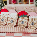 Four Christmas-themed faux camera tags Santa and Elf hats that read 'SANTA CAM', 'ELF CAM' and north pole surveillance 